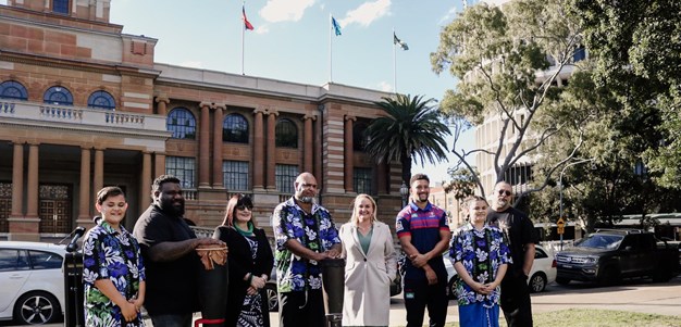 Shibasaki celebrates the raising of the Torres Strait Islander flag