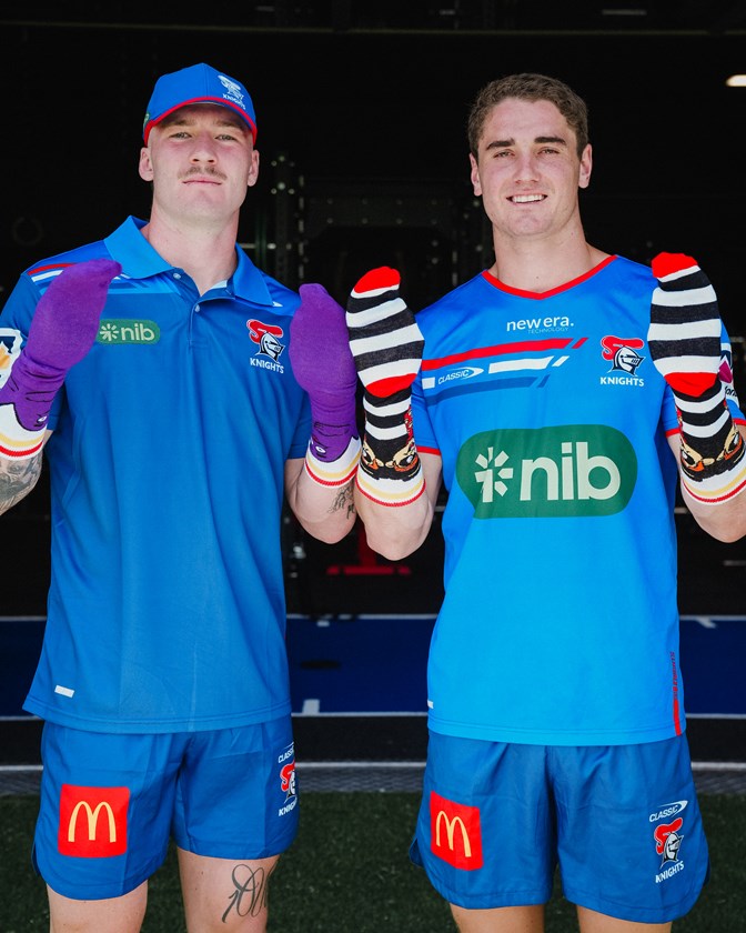 Riley Jones and Fletcher Myers show off the 2023 Silly Socks, available for purchase at all McDonalds restaurants.