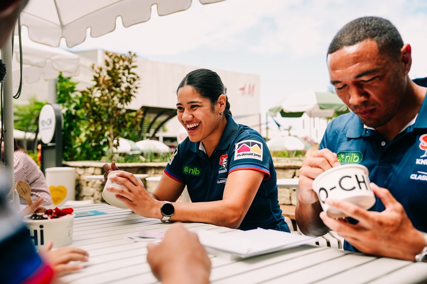 NRLW player Simone Karpani enjoys a meal on the Charlestown Square South Piazza.
