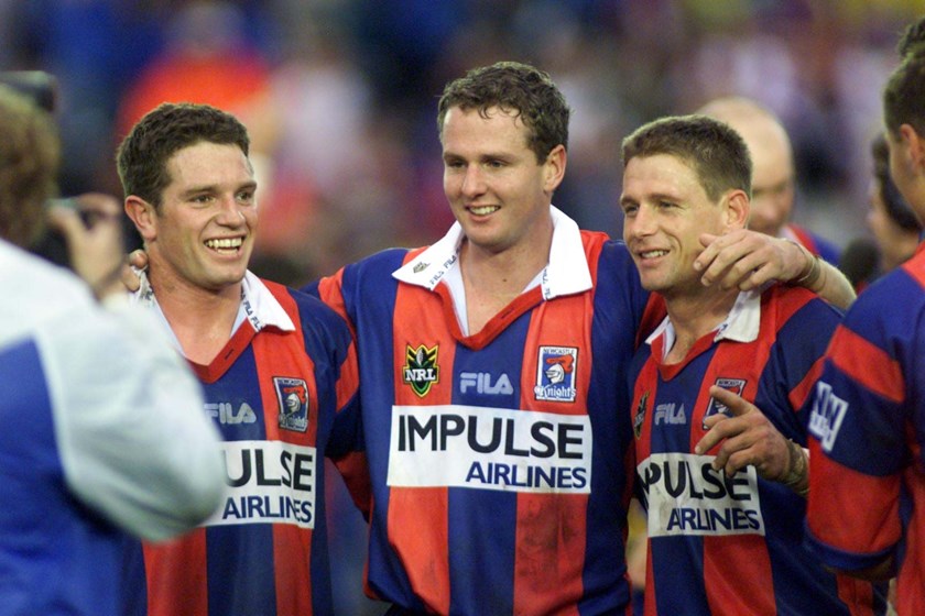 Danny Buderus, Mark Hughes and Billy Peden embrace after a home win at Marathon Stadium.