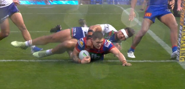 Brodie Jones slides over to get Newcastle into the lead