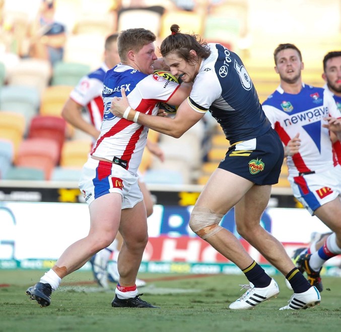 Luke Yates powers hard against the North Queensland Cowboys' defence during the side's last match up in Round 2 at Townsville. 