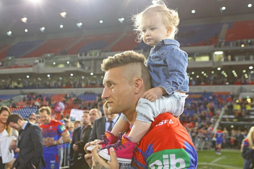 Newcastle Knight Tariq Sims and his daughter Lakia after the Knights' Round 25 match at Hunter Stadium. 