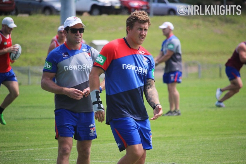 Trent Hodkinson watches on with his wrist still in a brace.