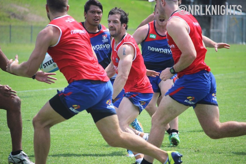 Jarrod Mullen looks to slip Robbie Rochow through a hole.